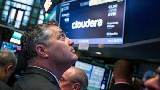 Tom Reilly, chief executive officer of Cloudera Inc., stands during the company's initial public offering (IPO) on the floor of the New York Stock Exchange (NYSE) in New York.