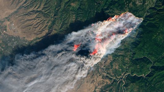 NASA's Operational Land Imager satellite image shows the Camp Fire burning at around 10:45 a.m. local time near Paradise, California, U.S., on November 8, 2018.
