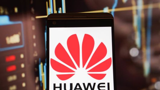 The logo of Huawei is seen on a smartphone.