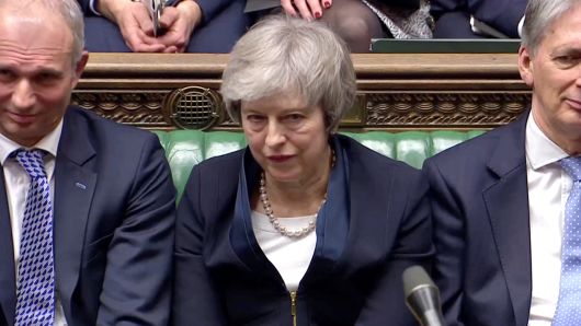 Prime Minister Theresa May sits down in Parliament after the vote on May's Brexit deal, in London, Britain, January 15, 2019 in this screengrab taken from video.