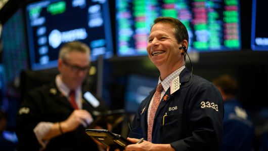A trader laughs ahead of the closing bell on the floor of the New York Stock Exchange (NYSE) on February 1, 2019 in New York City.