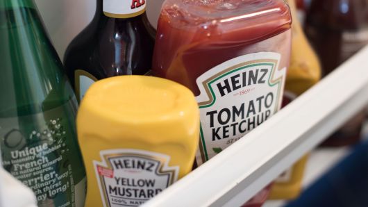Bottles of Heinz Kraft Co. Heinz brand Tomato Ketchup and Yellow Mustard are arranged for a photograph in Dobbs Ferry, New York, on Wednesday, Feb. 20, 2019.