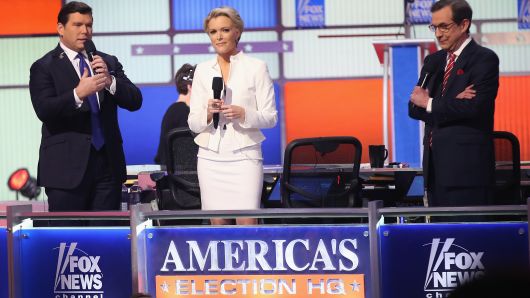 Moderators (Lto R) Bret Baier, Megyn Kelly and Chris Wallace are introduced at the Republican presidential debate sponsored by Fox News at the Fox Theatre on March 3, 2016 in Detroit, Michigan. Voters in Michigan will go to the polls March 8 for the State's primary.