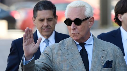 Former advisor to US President Donald Trump, Roger Stone, waves as he arrives for a court hearing on March 14, 2019, in Washington DC. (Photo by Andrew CABALLERO-REYNOLDS / AFP) (Photo credit should read ANDREW CABALLERO-REYNOLDS/AFP/Getty Images)