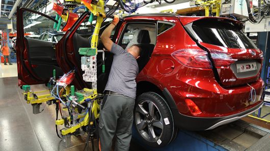 North Rhine-Westphalia, Köln: An employee installs a door in a Ford Fiesta at the Ford plant. The US car manufacturer Ford wants to cut 5000 jobs in Germany.