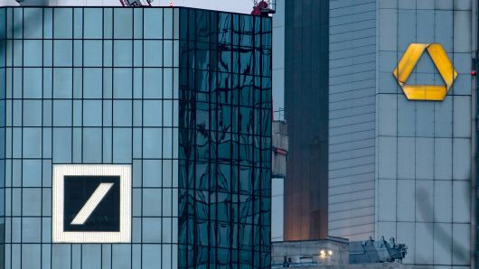 Picture taken on March 17, 2019 shows the headquarters of German banks Deutsche Bank (L) and Commerzbank in Frankfurt am Main, western Germany.