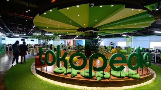 The PT Tokopedia logo is displayed at the company's offices in Jakarta, Indonesia, on Friday, Feb. 19, 2016. Photographer: Dimas Ardian/Bloomberg via Getty Images