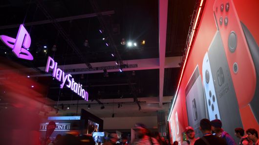 Sony Corp. PlayStation and Nintendo Co. Switch game console signage is displayed during the E3 Electronic Entertainment Expo in Los Angeles, California, U.S., on Wednesday, June 14, 2017.