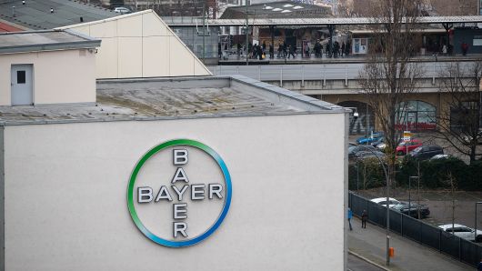 The Bayer AG logo sits on the exterior of the drugmaker's offices in Berlin, Germany, on Friday, Dec. 1, 2017.
