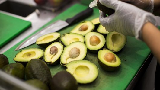 A worker prepares avocados inside a Sweetgreen restaurant in Boston, Massachusetts.