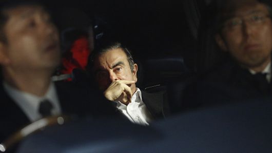Carlos Ghosn, former chairman of Nissan Motor Co., center, sits in a vehicle as he leaves his lawyer's office in Tokyo, Japan, on Wednesday, March 6, 2019.