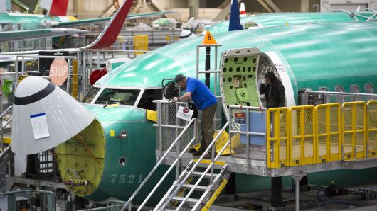 Employees work on Boeing 737 MAX airplanes at the Boeing Renton Factory in Renton, Washington on March 27, 2019.