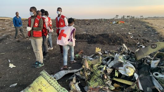Rescuers work beside the wreckage of an Ethiopian Airlines' aircraft at the crash site, some 50 km east of Addis Ababa, capital of Ethiopia, on March 10, 2019. All 157 people aboard Ethiopian Airlines flight were confirmed dead as Africa's fastest growing airline witnessed the worst incident in its history. The Sunday crash, which involved a Boeing 737-800 MAX, occurred a few minutes after the aircraft took off from Addis Ababa Bole International Airport to Nairobi, Kenya. It crashed around Bishoftu town, the airline said. (Xinhua/Wang Shoubao) (Xinhua/ via Getty Images)