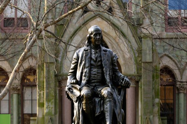 A statue of Benjamin Franklin, founder of the University of Pennsylvania, on the school's campus in Philadelphia, Pennsylvania.