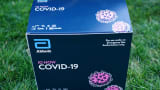 A box containing a 5-minute test for COVID-19 from Abbott Laboratories is pictured during the daily briefing on the novel coronavirus, COVID-19, in the Rose Garden of the White House in Washington, DC, on March 30, 2020.