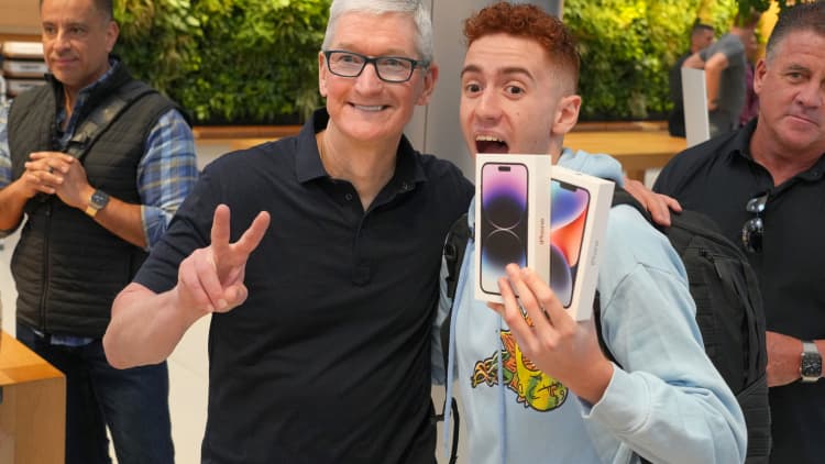 Apple launches iPhone 14 as customers line up to meet Tim Cook and get new tech